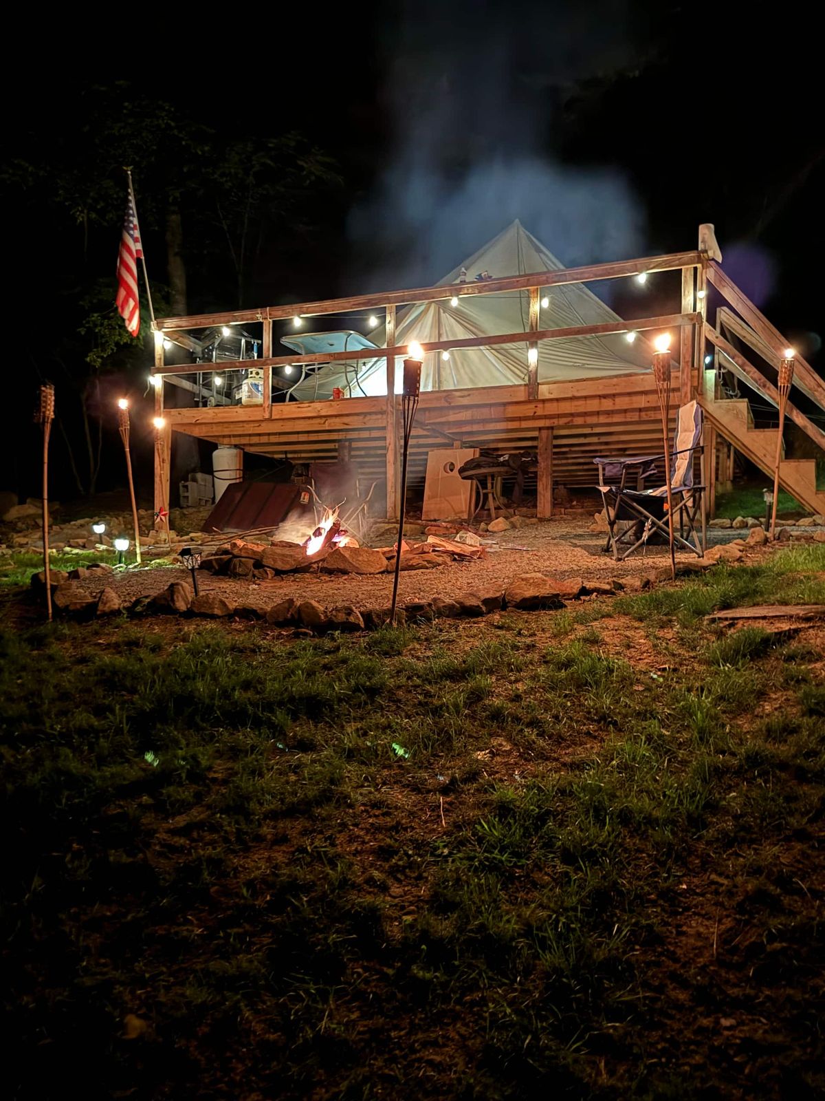 The Mountain Side Yurt deck lit up at night